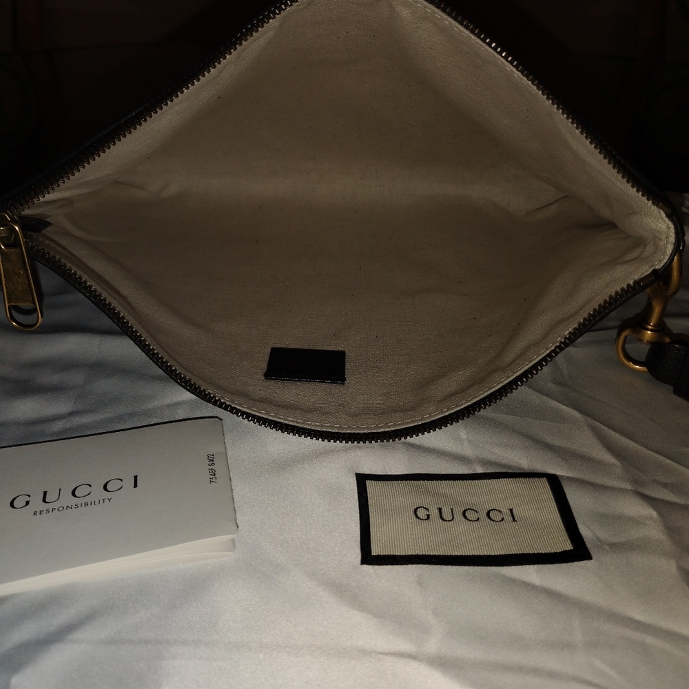 Gucci Logo wristlet clutch printed leather medium